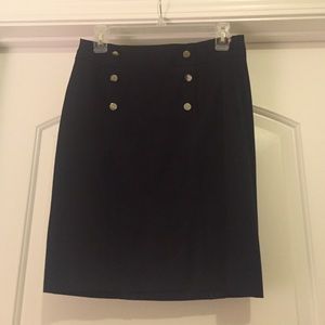 Pencil skirt with button detail.