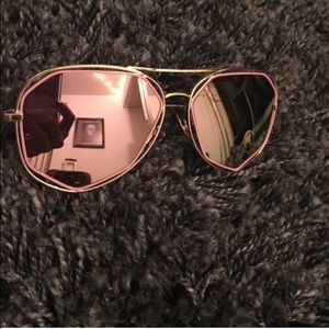 Pink and gold aviator style sunglasses
