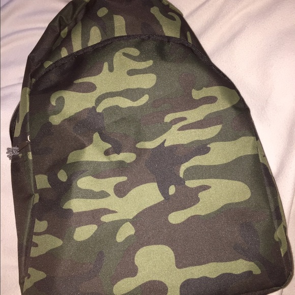 Camouflage backpack with varies of school supplies