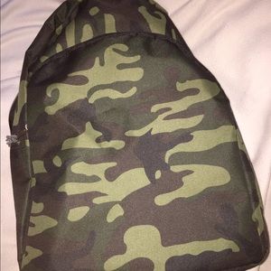 Camouflage backpack with varies of school supplies