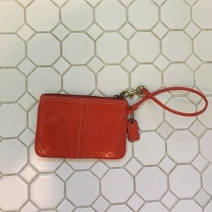 Orange Coach wristlet
