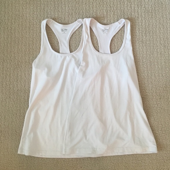 Two white champion athletic tanks