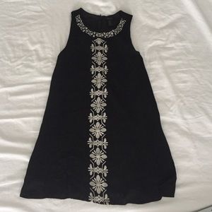 Black shift dress with white pattern