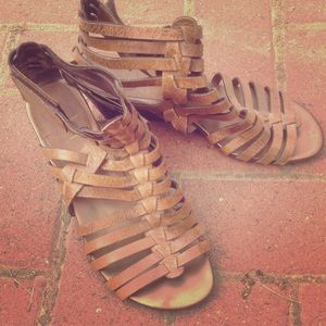 Brown gladiator ankle sandals.