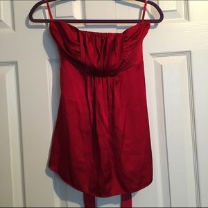 Silky strapless red top.