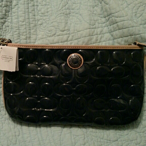 Coach clutch with wrist strap