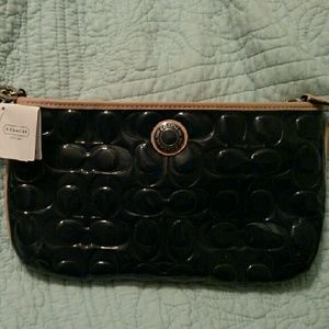 Coach clutch with wrist strap