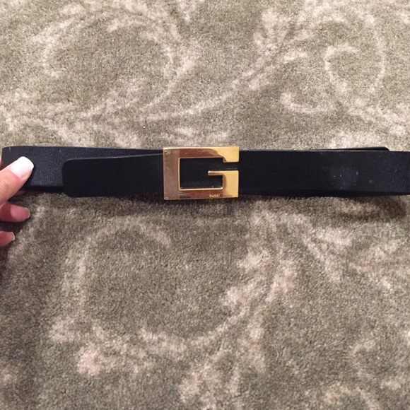 Black leather Gucci belt with gold buckle