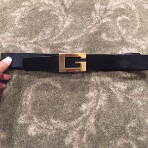 Black leather Gucci belt with gold buckle