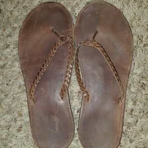 Brown leather flip flops