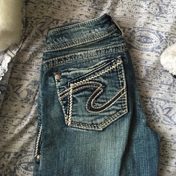 Silver boot cut distressed jeans