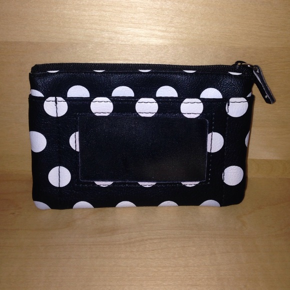 A black and white polka-dotted change purse