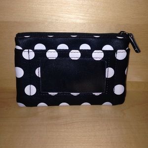 A black and white polka-dotted change purse