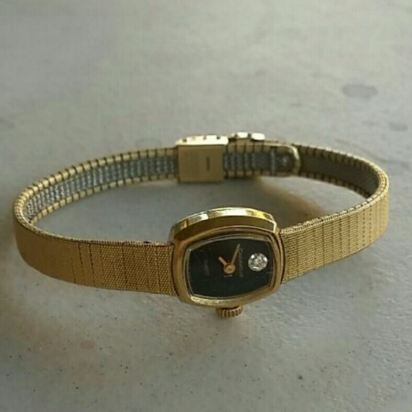 Vintage gold watch with a real diamond chip