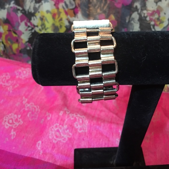 Never metal and faux leather bracelet.