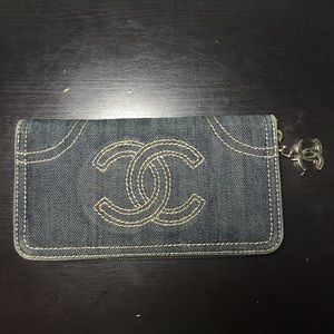 Used denim and gold wallet