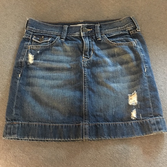 Distressed denim mini skirt
