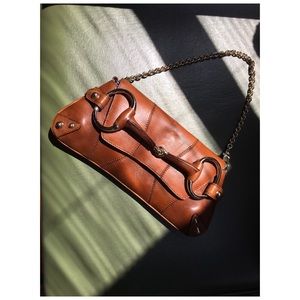 Gucci horsebit clutch with light gold chain strap.