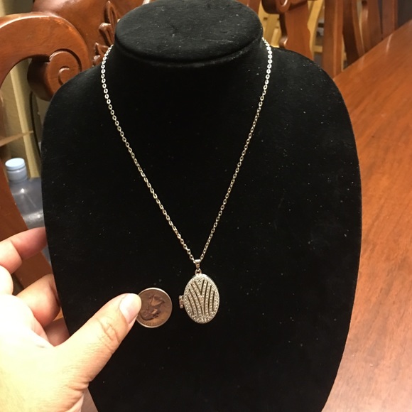 Silver metal base locket. Brand new with 18' chain