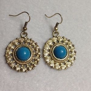 Gold and blue drop earrings.
