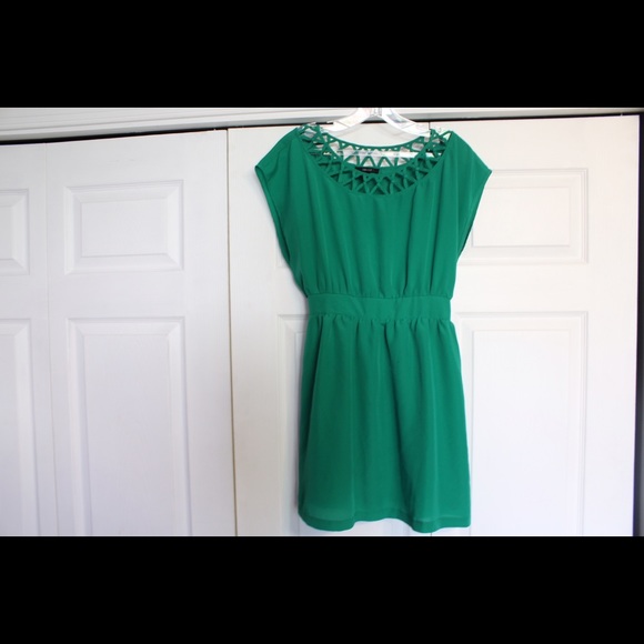 Green dress with geometric pattern.
