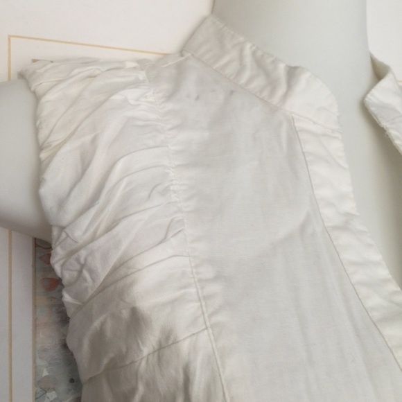 Carole Little white sleeveless ruffled top