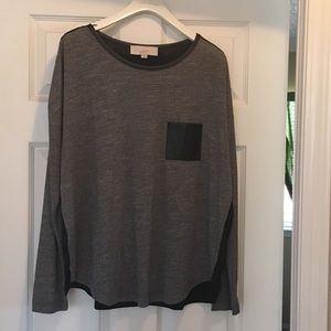 Cute long sleeve top with leather pocket