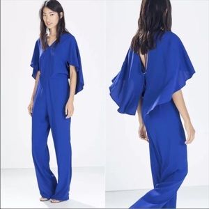 Zara blue jumpsuit with partial open back & cape