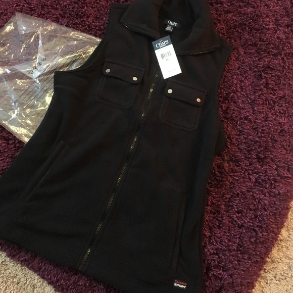 Black fleece vest with silver embellishments.