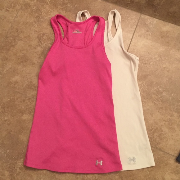 Two under armour heat gear tanks size small.