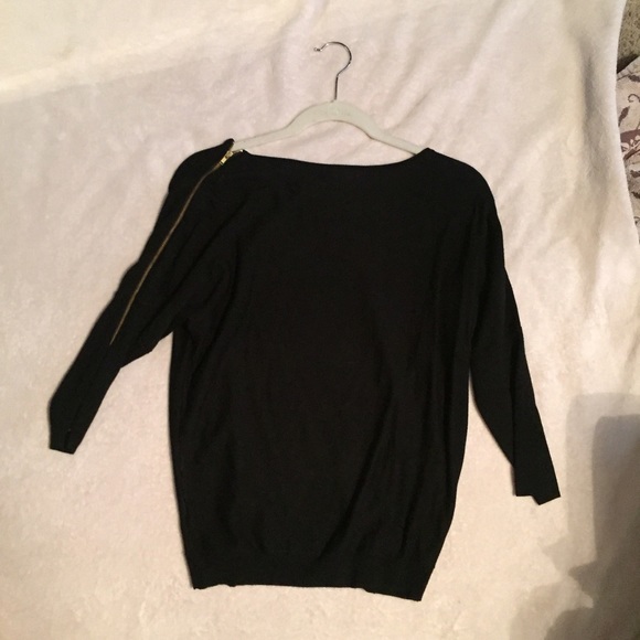 Black sweater with zipper on one sleeve