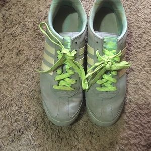 Grey and green Adidas shoes