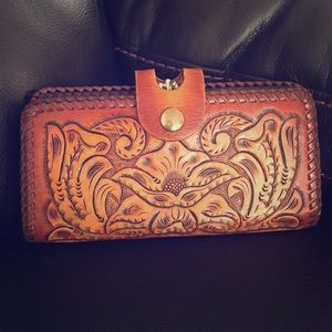 Tooled leather wallet.