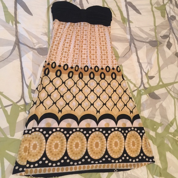 MIDI strapless black and gold dress.