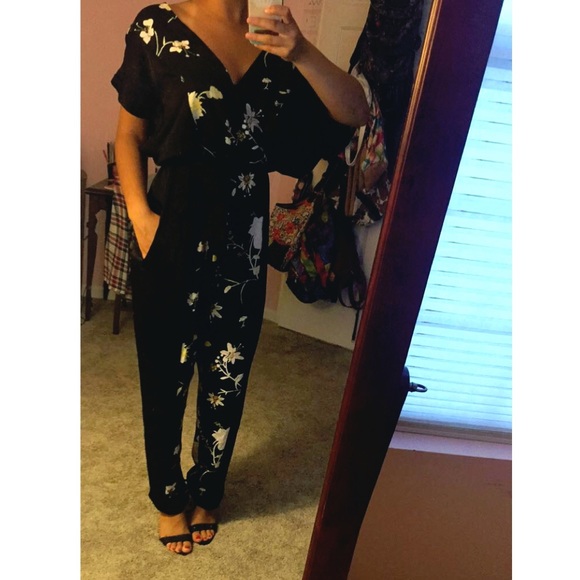 A black Jumpsuit with yellow Floral-Print