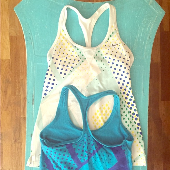 2 Nike athletic tank tops with built in bra.