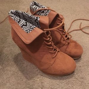 Lace up wedge booties.