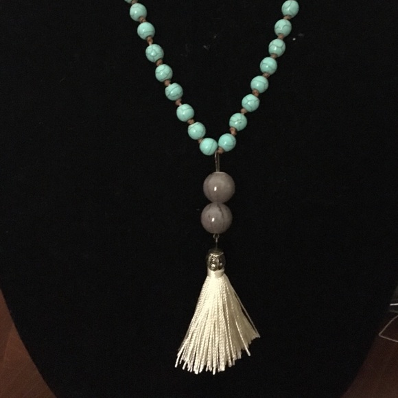 Turquoise with white tassels