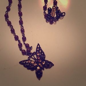 Butterfly pendant with beaded chain.