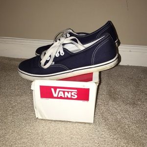 Navy blue Vans sneakers.