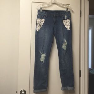 A pair of ripped jeans, in good condition.