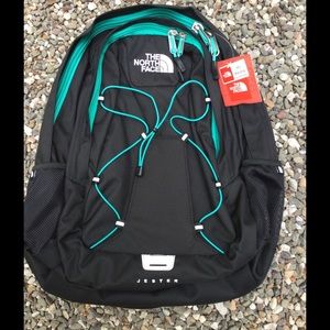 black and blue north face backpack
