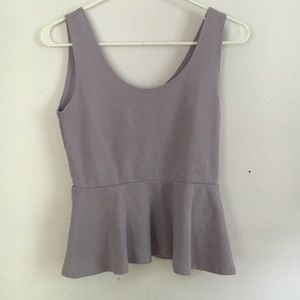 Purple, sleeveless, peplum top.