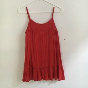 Red, flowy, spaghetti strap tank.