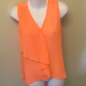Sleeveless blouse w/ ruffle front.