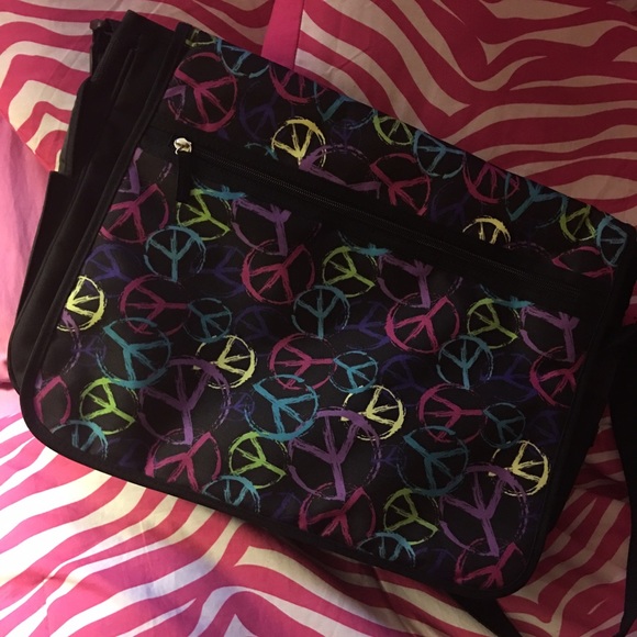 Messenger backpack with peace sign design