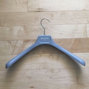 Gray PRADA clothes hanger.