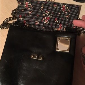 Black faux leather crossbody with floral inside