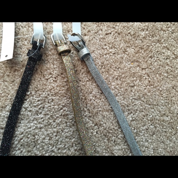Three glitter belts