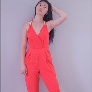 Coral jumpsuit with gold rings